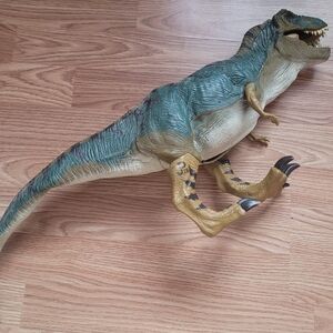Green and Tan Dinosaur Reptile Toy